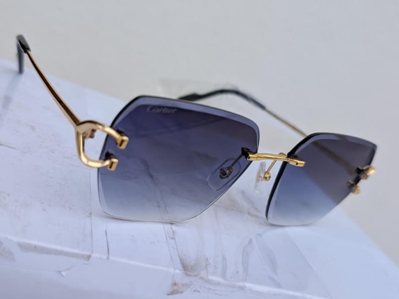 Cartier Rimless C Wire Sunglasses, Mod#CT0466S Vintage Gold Black Frame Blue Lens Eyewear